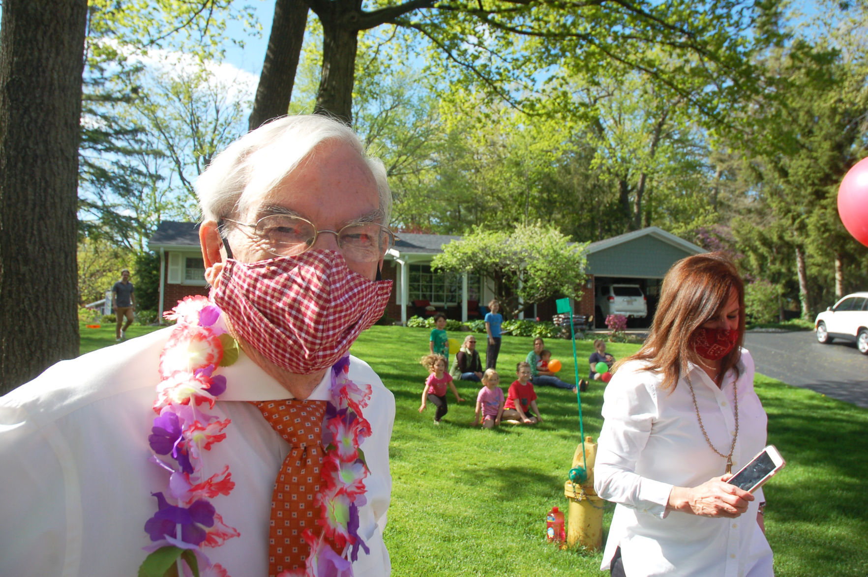 Gene Haseley wears face mask during birthday parade